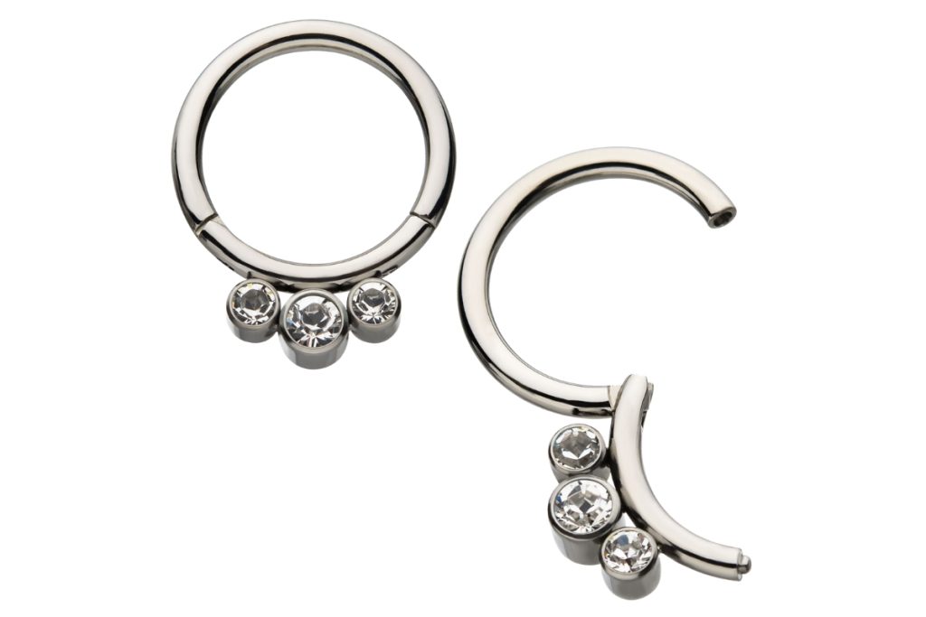 Silver hoop earrings with triple crystals.