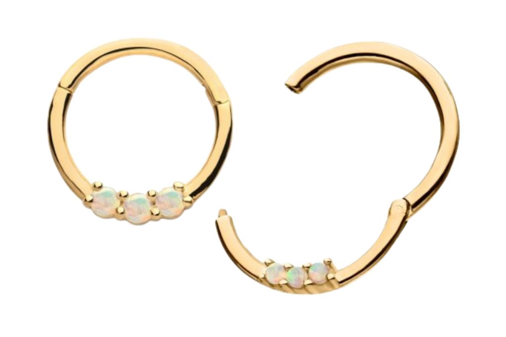 Gold hoop earrings with small opals.