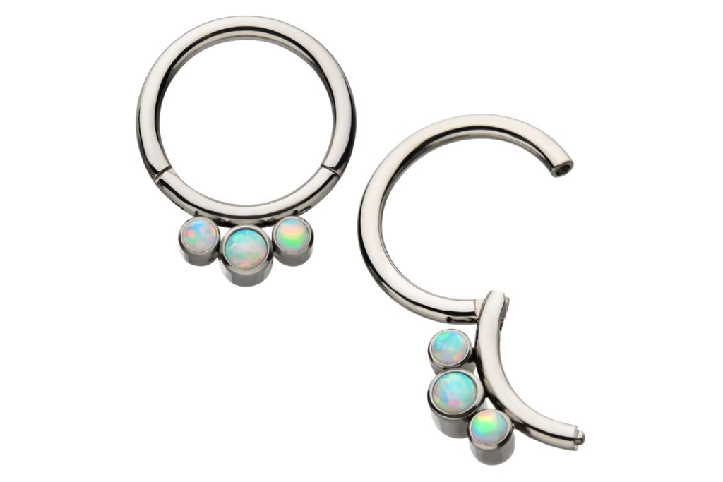 Silver hoop earrings with opal trio.