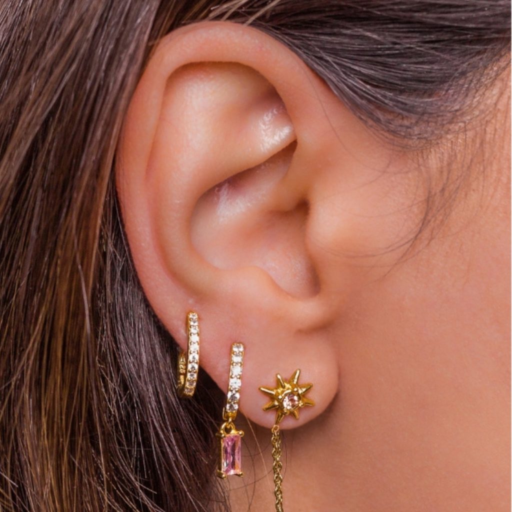Gold ear piercing jewelry with dangling chain charm