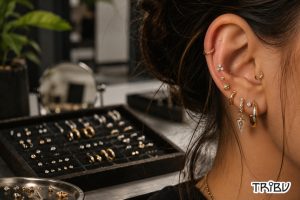 Curated ear styling with multiple gold piercing jewelry